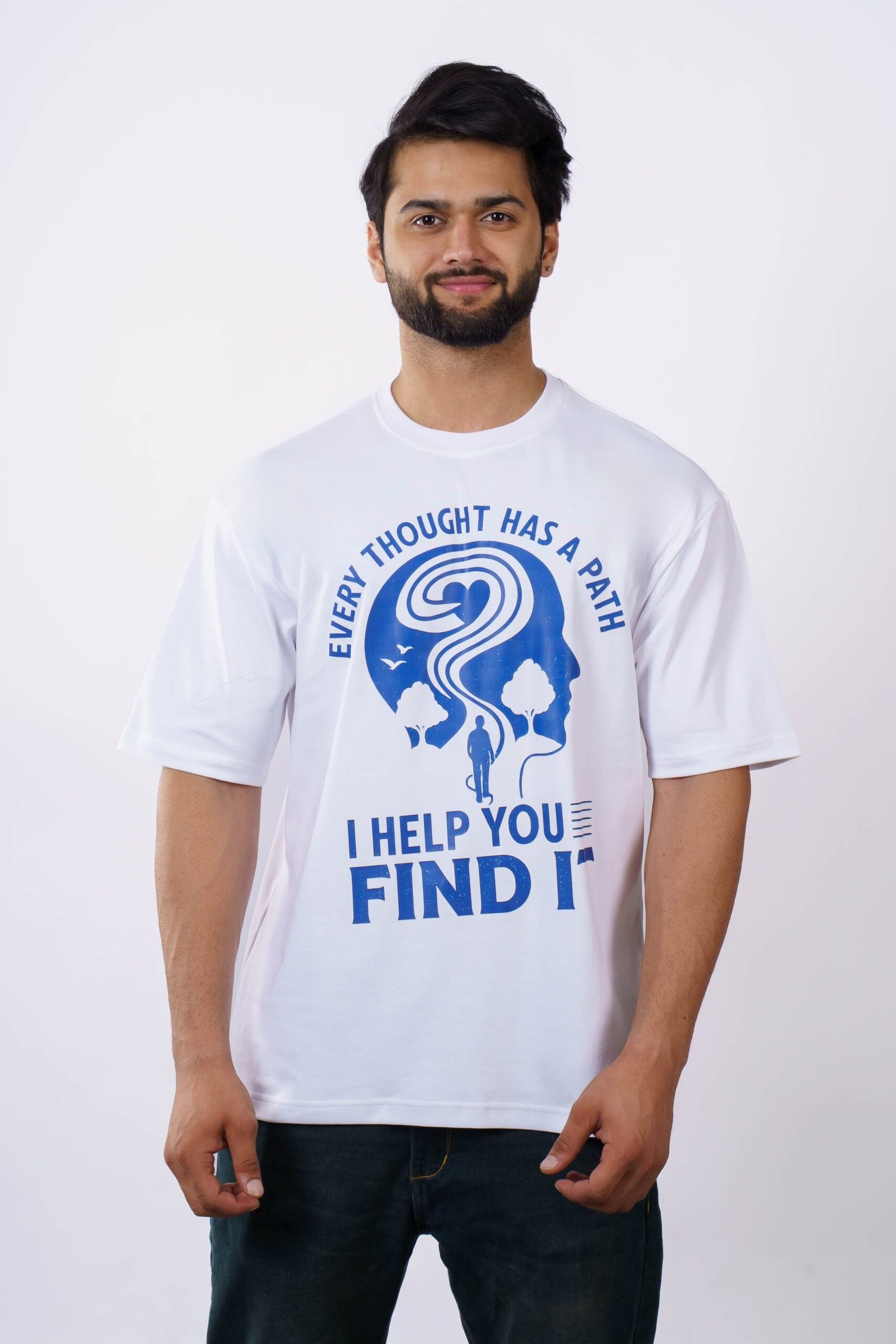 A man wearing a white t-shirt with a motivational print, standing against a plain background.